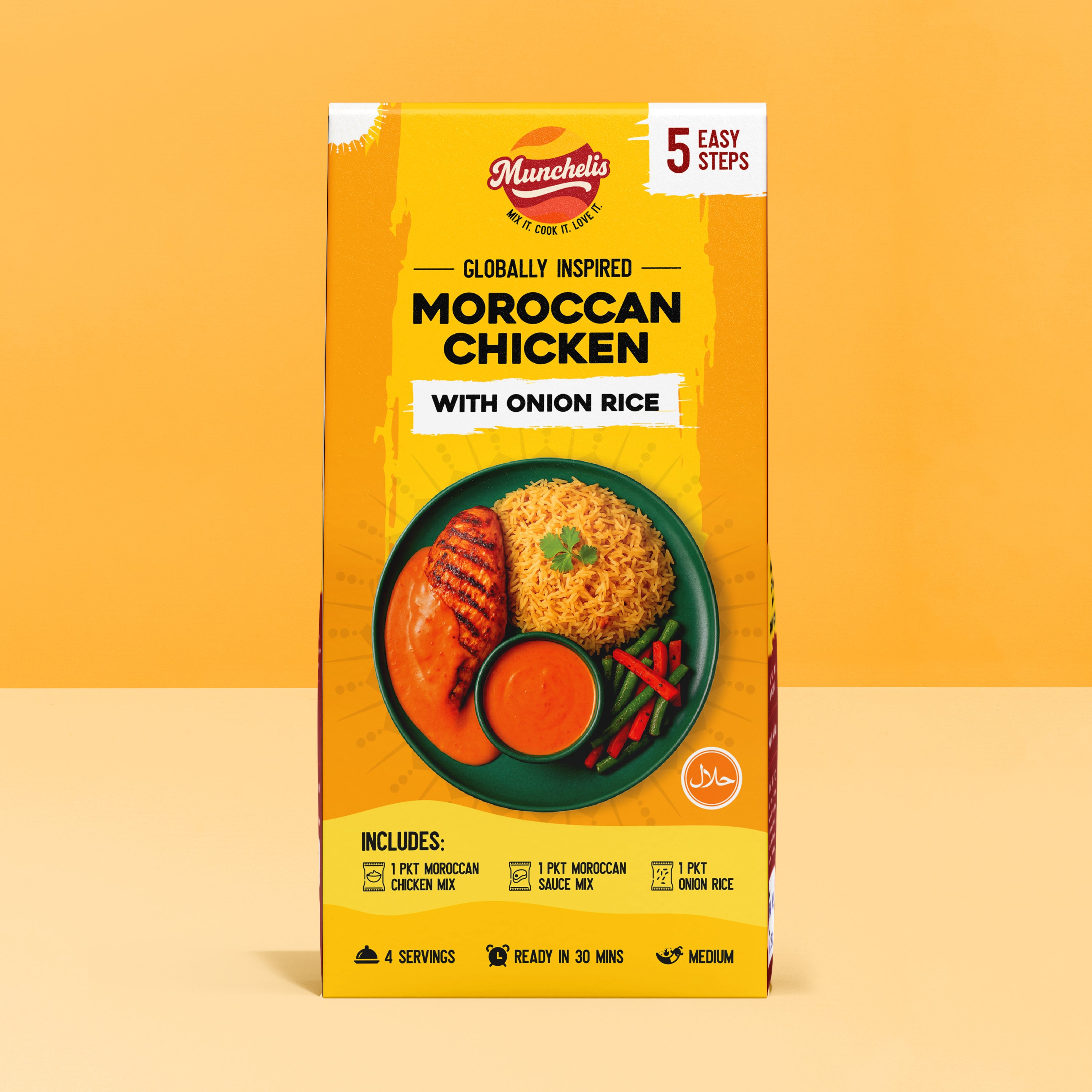 A vibrant product packaging box of Munchelis Moroccan Chicken Meal Kit with Onion Rice displayed against a bright yellow background. The front of the box prominently features the Munchelis brand logo at the top with the tagline “Mix it. Cook it. Love it.” The packaging highlights “5 Easy Steps” for cooking the meal. The main text reads “Globally Inspired Moroccan Chicken with Onion Rice,” emphasizing an authentic, ready-to-cook meal kit.