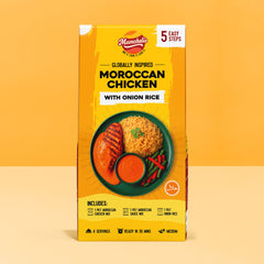 A vibrant product packaging box of Munchelis Moroccan Chicken Meal Kit with Onion Rice displayed against a bright yellow background. The front of the box prominently features the Munchelis brand logo at the top with the tagline “Mix it. Cook it. Love it.” The packaging highlights “5 Easy Steps” for cooking the meal. The main text reads “Globally Inspired Moroccan Chicken with Onion Rice,” emphasizing an authentic, ready-to-cook meal kit.